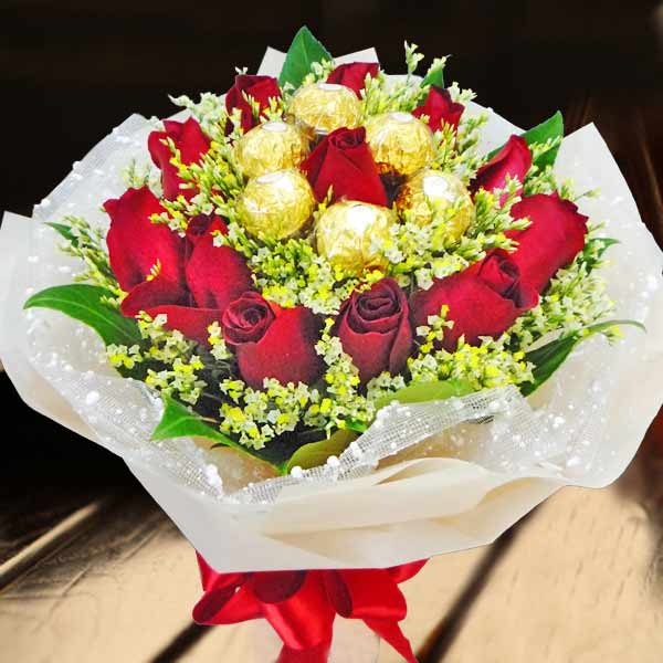 12 Red Roses With Rochers Hand Bouquet Delivery